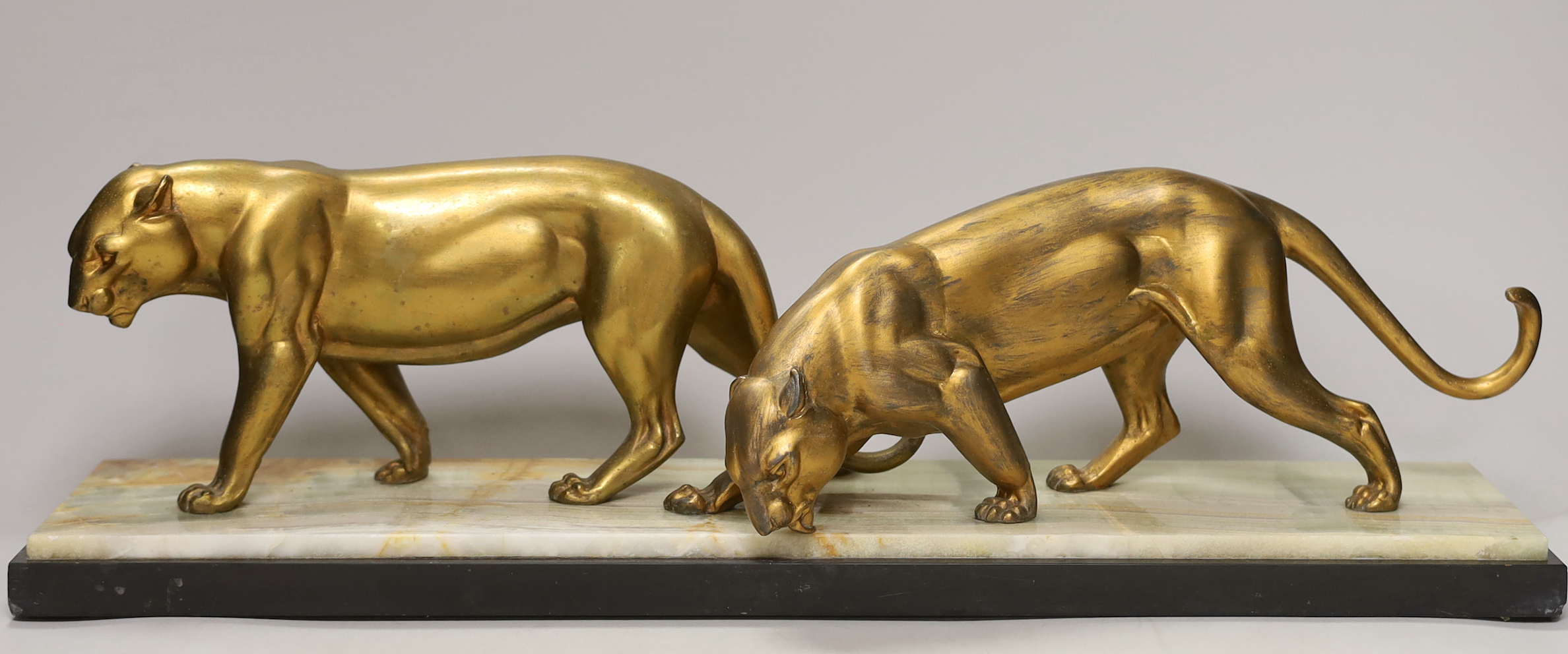 A French gilt metal ‘panther’ model group on a marble base, 56.5cm